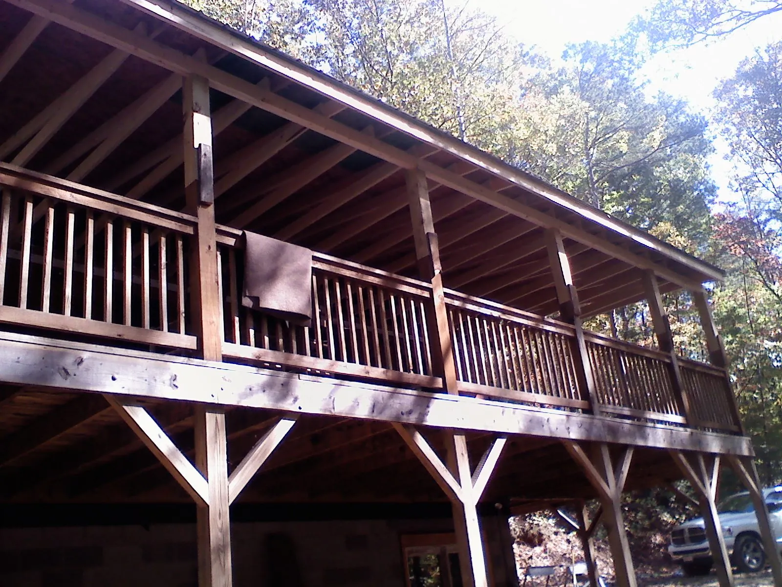 Timber framing under a new elevated porch and deck in Columbia